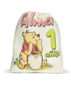 Bolsita de tela personalizada tono crema con ilustración de Winnie Pooh, el nombre Alma y el número 1 añito para souvenir.